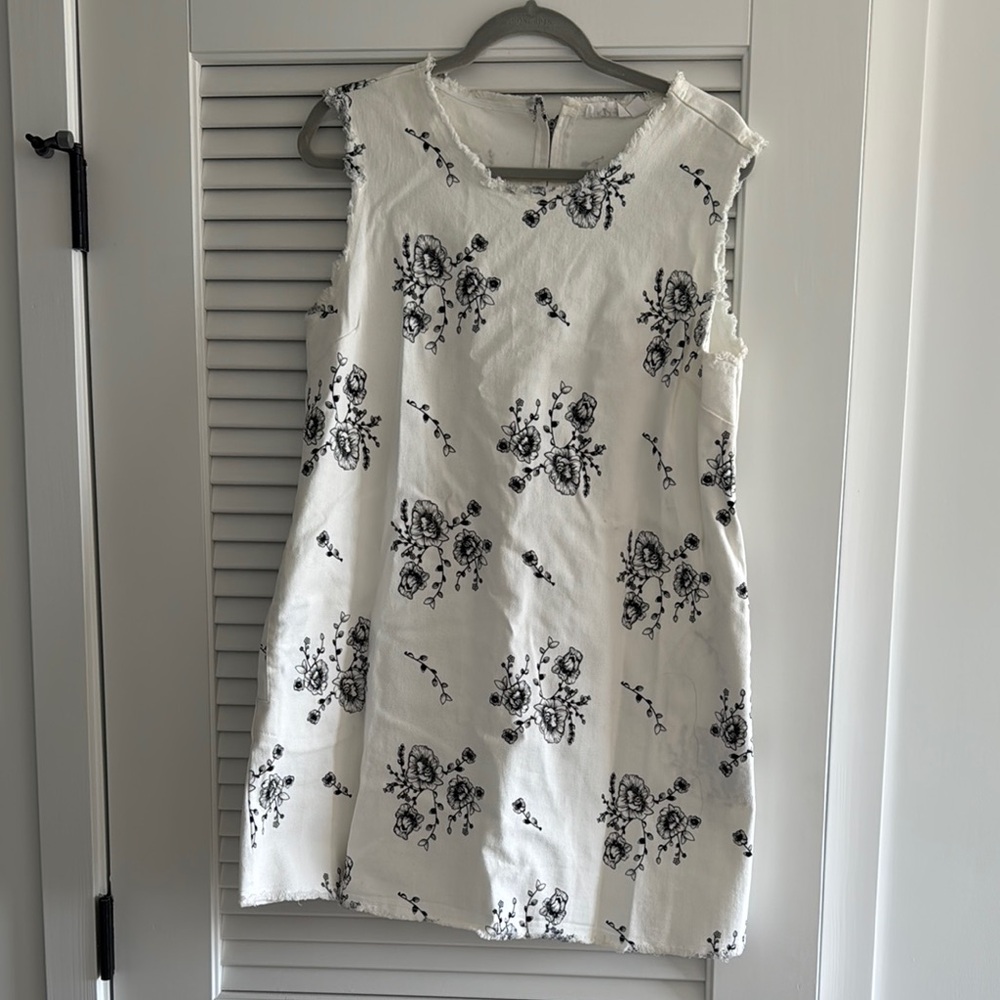White Sleeveless Dress with Black Floral Pattern